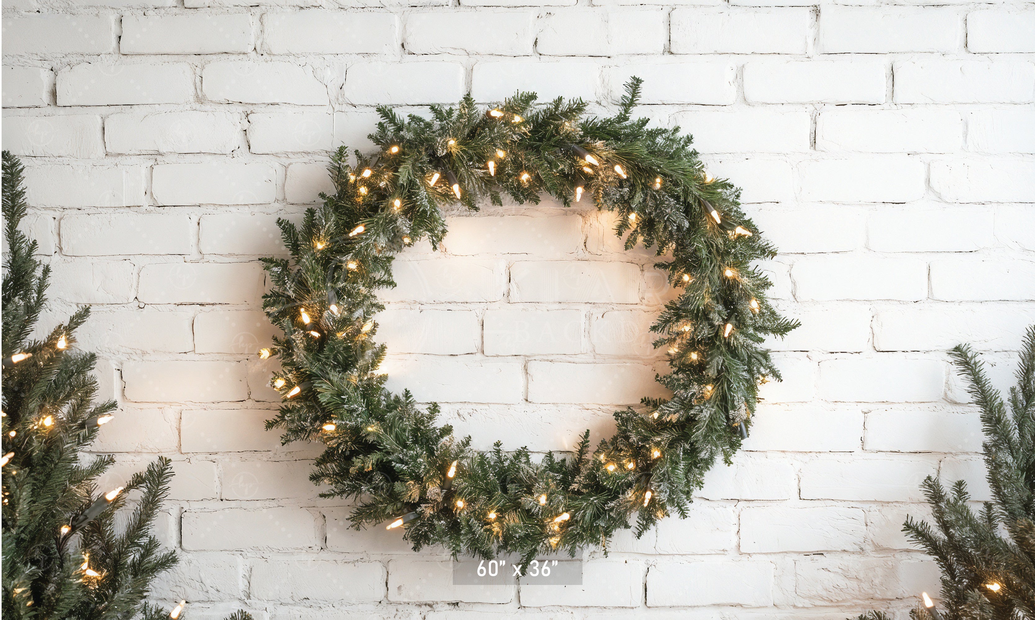 Lighted Wreath on White Brick Backdrop