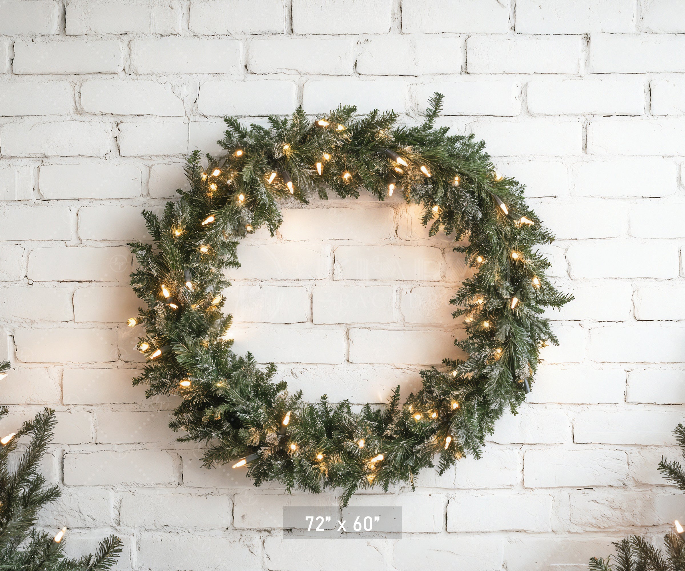 Lighted Wreath on White Brick Backdrop