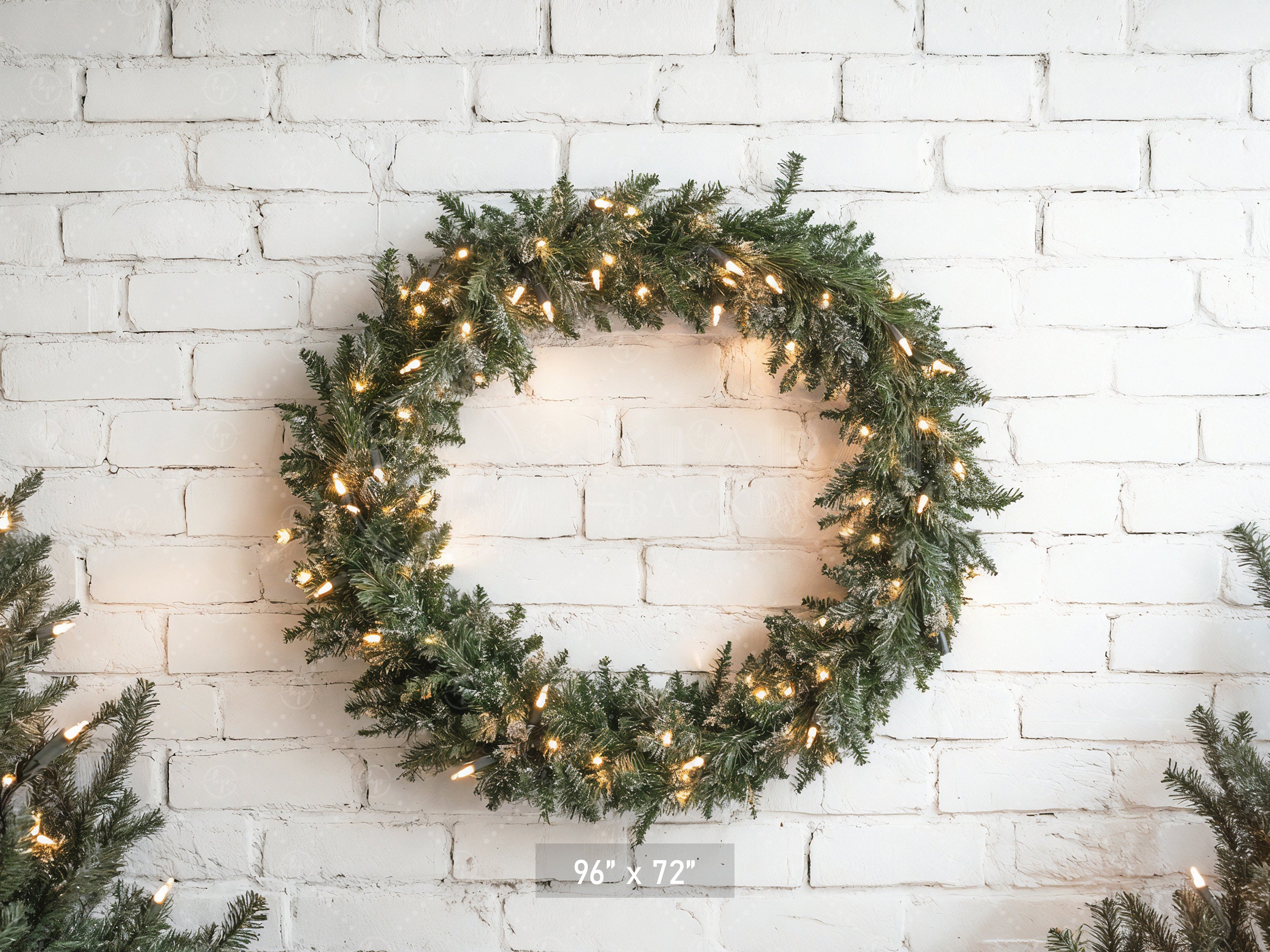 Lighted Wreath on White Brick Backdrop